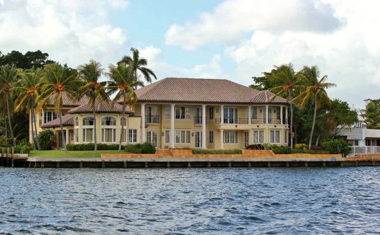 A waterfront home on Long Island with bulkhead and water in the foreground